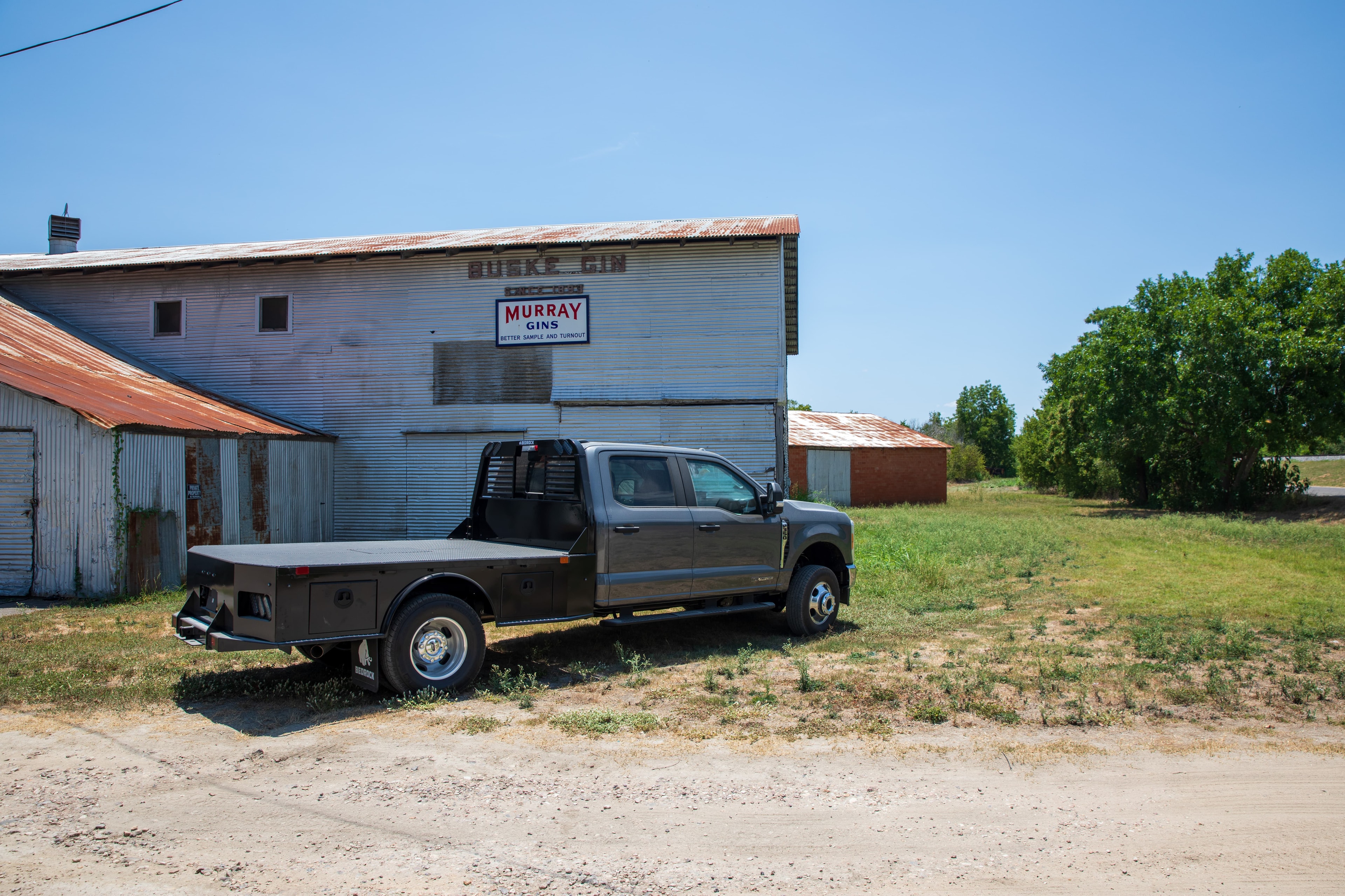 Bedrock Granite Series steel flatbed on a dark Ford dually